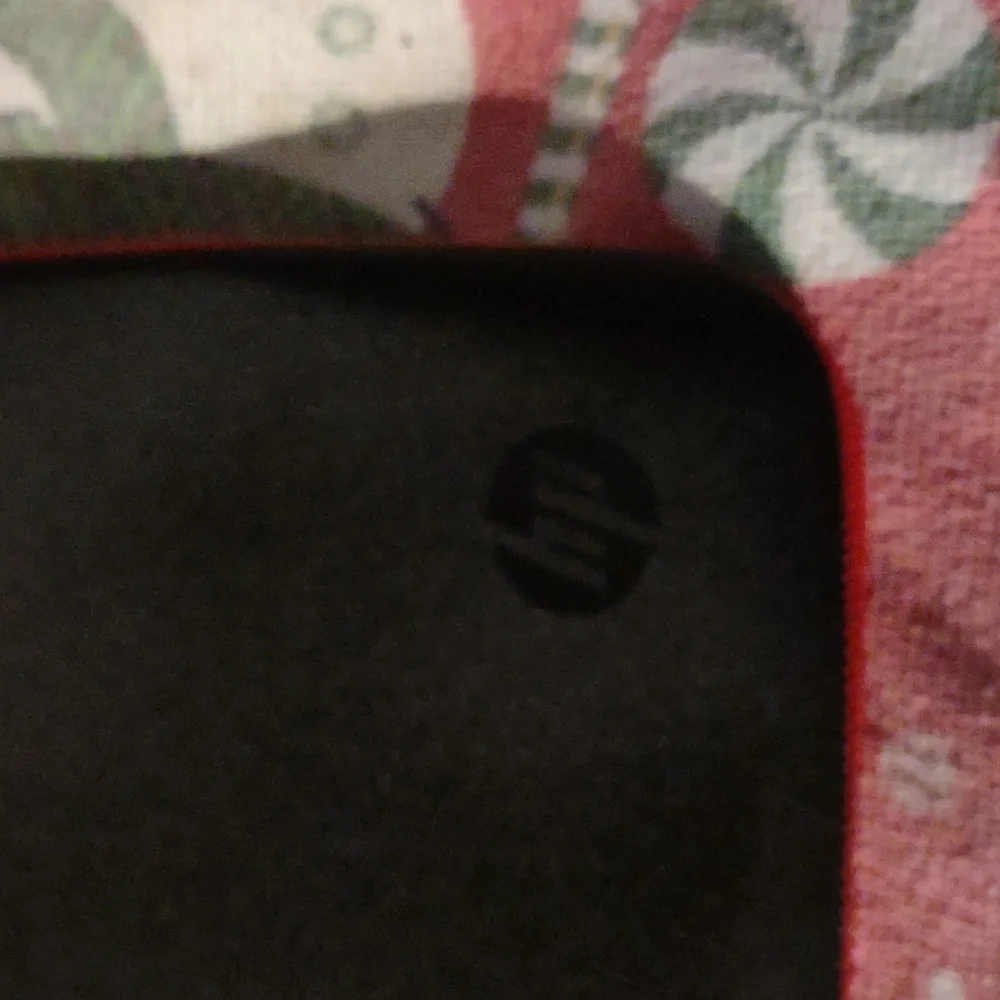 Hewlett-Packard black and red computer case/ cover